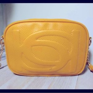 Bebe los Angeles purse. Mustard. Gold hardware. Never used NWOT Adjustable strap